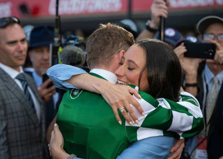 James McDonald and wife Katelyn Mallyon embrace after Via Sistina wins the G1 W.S Cox Plate at Moonee Valley